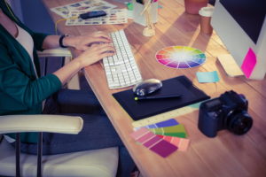 Designer working at her desk in creative office